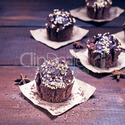 chocolate muffin sprinkled with nuts