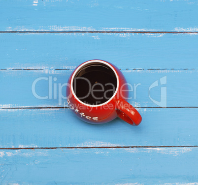 Black coffee in a red ceramic mug