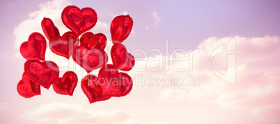Composite image of heart balloons