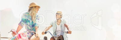 Couple on bike ride by the beach