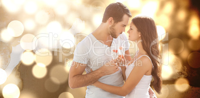 Composite image of young couple embracing each other