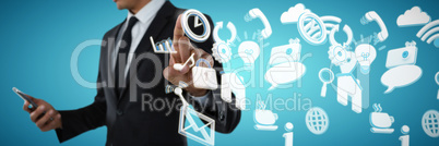 Composite image of mid section of businessman using phone while touching invisible interface