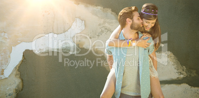 Composite image of man kissing woman while piggybacking