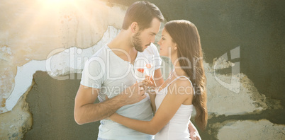 Composite image of young couple embracing each other