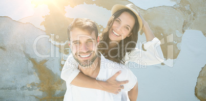 Composite image of man carrying woman