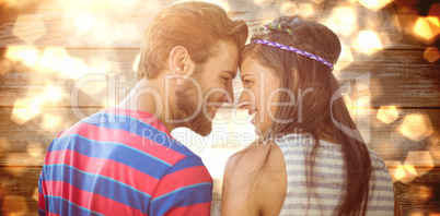 Composite image of happy young couple standing