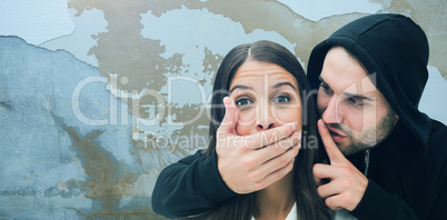 Composite image of woman being attacked by scary man
