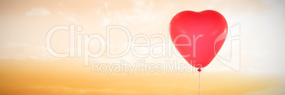 Composite image of valentines day heart balloon