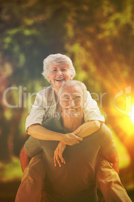 Man giving wife a piggyback