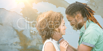 Composite image of young couple smiling
