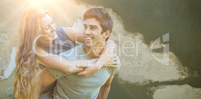 Composite image of man carrying woman