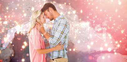 Composite image of attractive couple smiling at each other and hugging