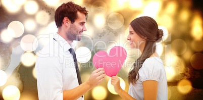 Composite image of pretty brunette giving boyfriend her heart