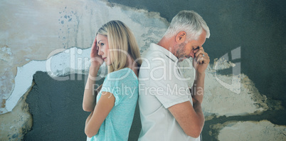 Composite image of unhappy couple not speaking to each other