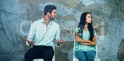 Composite image of couple sitting on chairs having argument