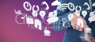 Composite image of mid sectiong of businessman using tablet computer
