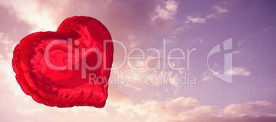 Composite image of red heart balloon