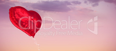 Composite image of red heart balloon