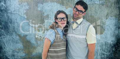 Composite image of happy geeky hipster couple with silly faces