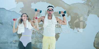 Composite image of geeky hipster couple lifting dumbbells in sportswear
