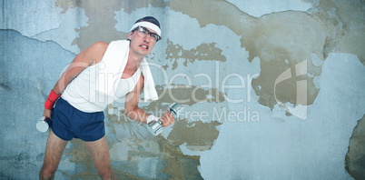 Composite image of geeky hipster lifting dumbbells in sportswear