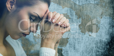 Composite image of peaceful woman praying with joining hands and eyes closed