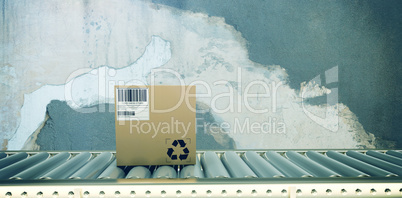 Composite image of packed carton box on production line