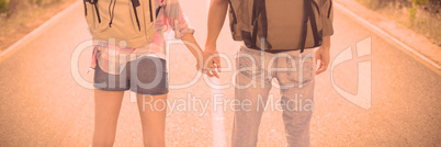 Hiking couple standing on countryside road