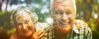 Portrait of senior couple laughing in back yard