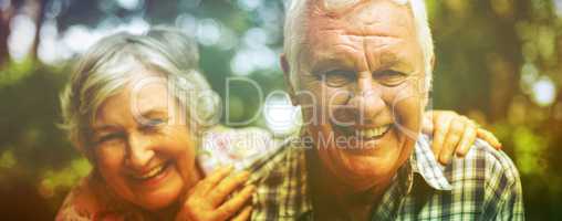 Portrait of senior couple laughing in back yard