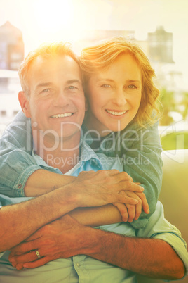 Portrait of happy woman hugging her husband