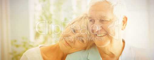 Happy senior couple smiling at home
