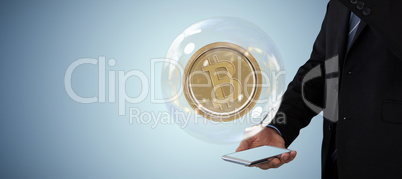 Composite image of mid section of businessman gesturing over smartphone