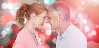 Composite image of casual couple smiling at each other