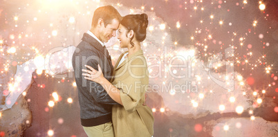 Composite image of side view of romantic couple hugging Composite image of side view of romantic couple hugging