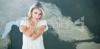 Composite image of sad pretty blonde looking at camera