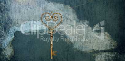 Composite image of gold heart key