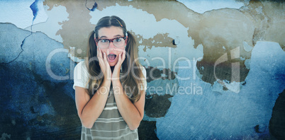 Composite image of surprised geeky hipster looking at camera