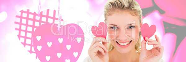 Valentines woman holding haerts with love hearts background