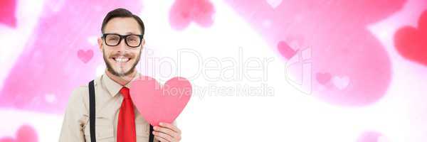 Valentines man holding heart with love hearts background