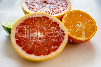 Colorful half citrus fruit, side view, closeup.