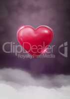 Shiny heart glowing with purple misty background