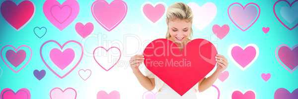 Valentines woman holding heart with love hearts background