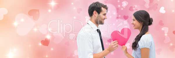 Valentines couple holding heart with love hearts background