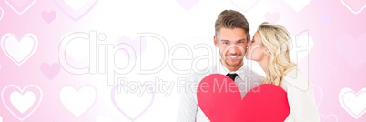 Valentines couple holding heart with love hearts background