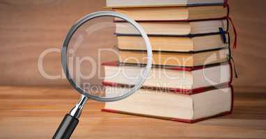 3D Magnifying glass over books