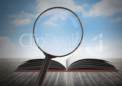 3D Magnifying glass over book with sky