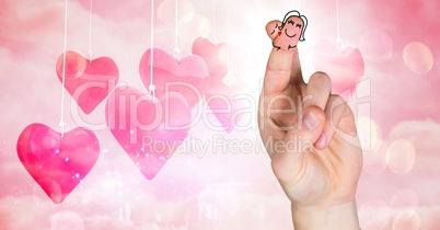 Valentine's fingers love couple and hanging hearts