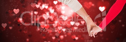 Valentines couple holding hands and love hearts background