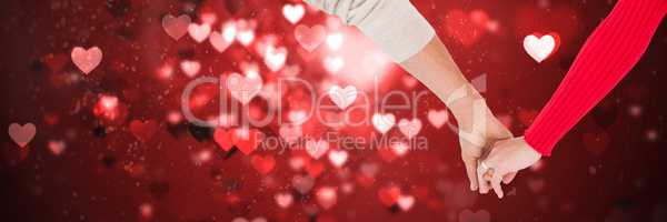 Valentines couple holding hands and love hearts background